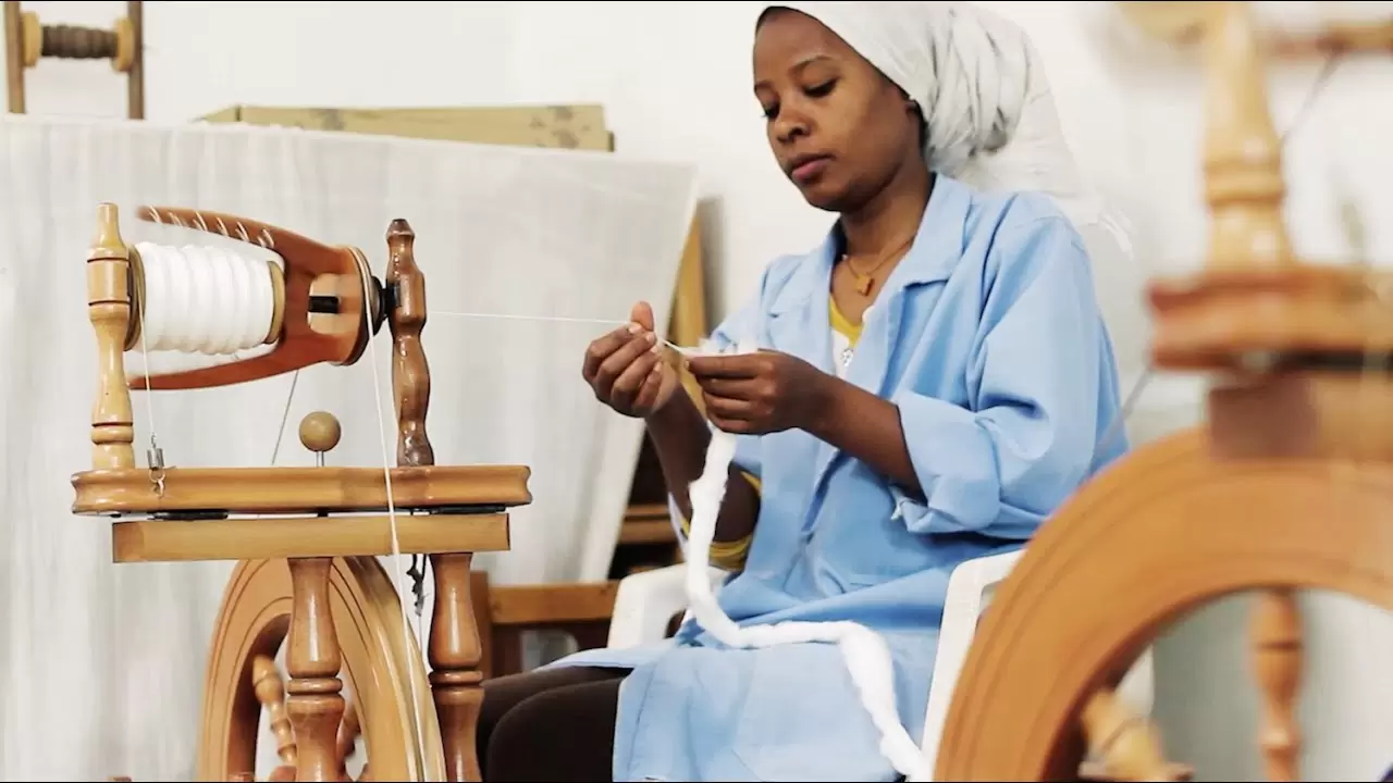 Things to do in Addis Ababa, a woman working at sabahar threading a needle